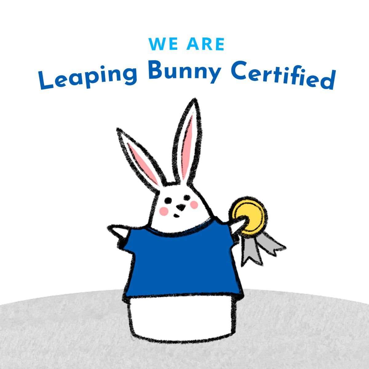 Cartoon bunny wearing a blue shirt, holding a gold medal, and surrounded by text that reads 'WE ARE Leaping Bunny Certified'.